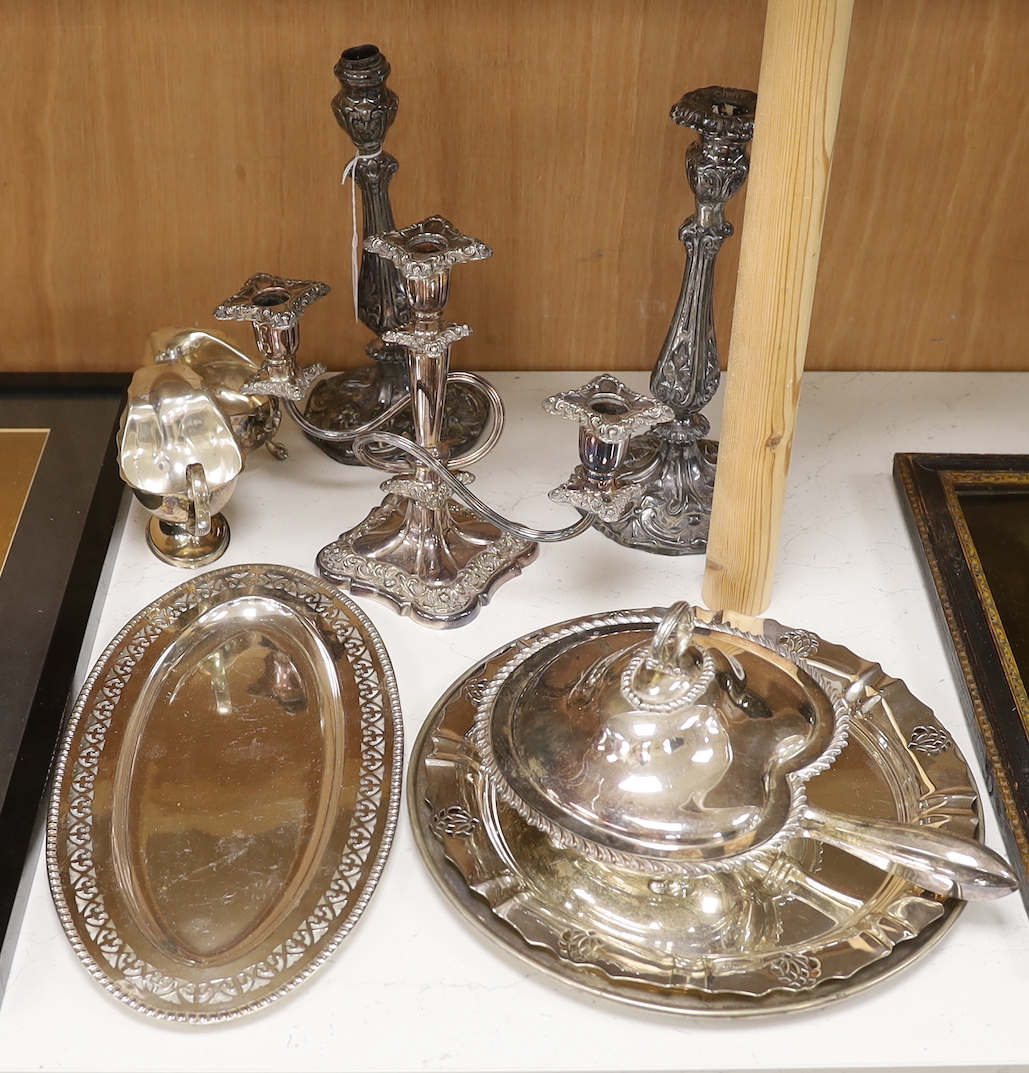 A selection of assorted plated ware, to include a pair of candlesticks, a pair of sauceboats, etc. tallest 28.5cm